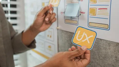 A person showing an UX card