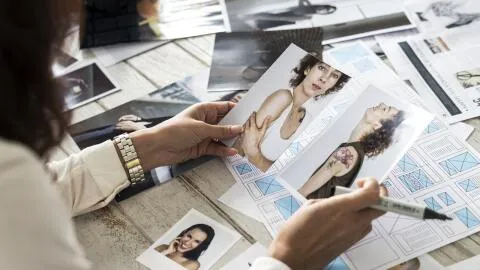 A woman comparing and optimizing images.